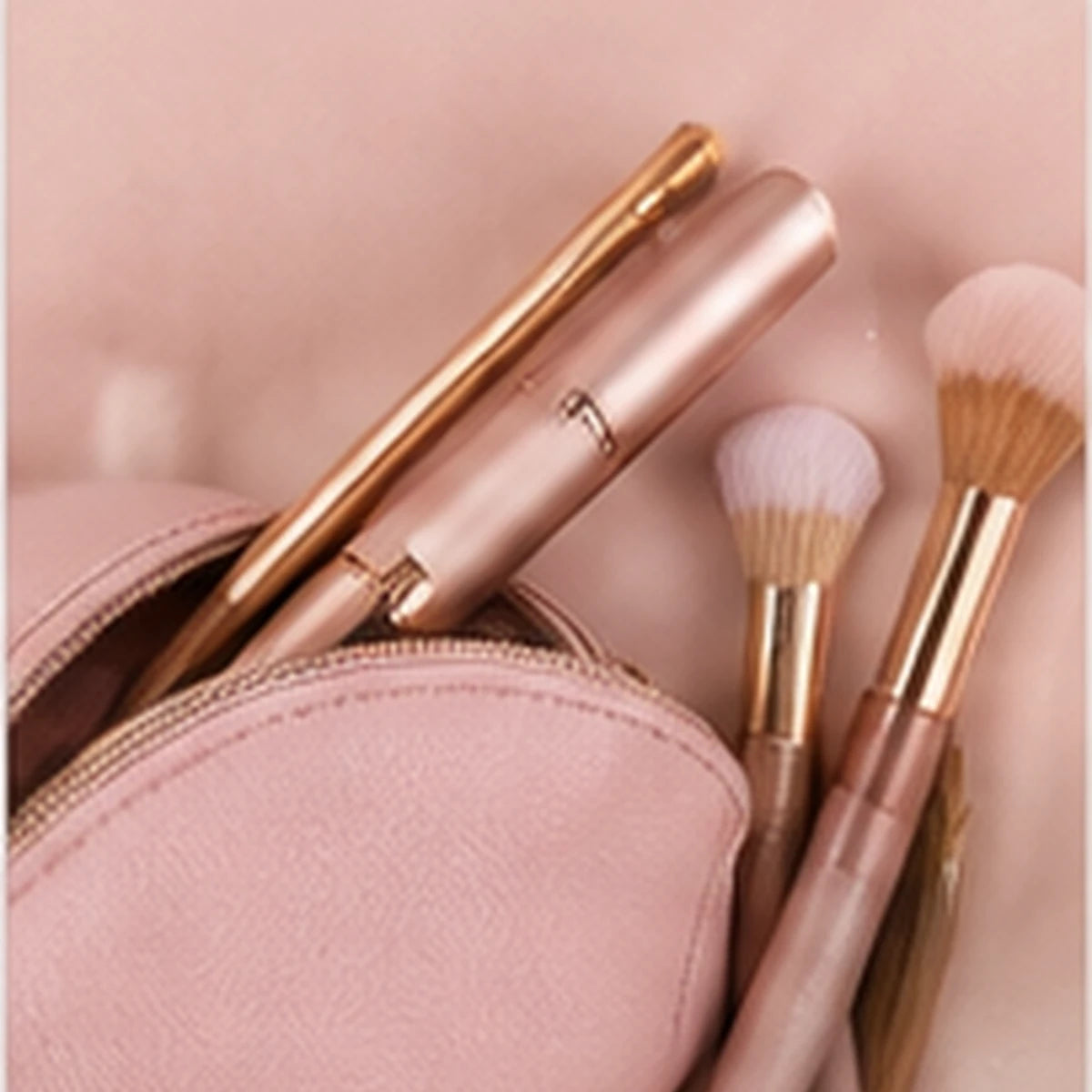 Compact Rose Gold brow trimmer in a beauty pouch